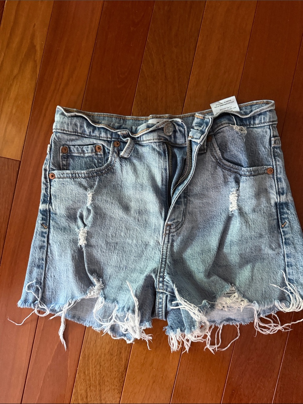 Women’s Light Blue Distressed Denim Shorts with Frayed Hem